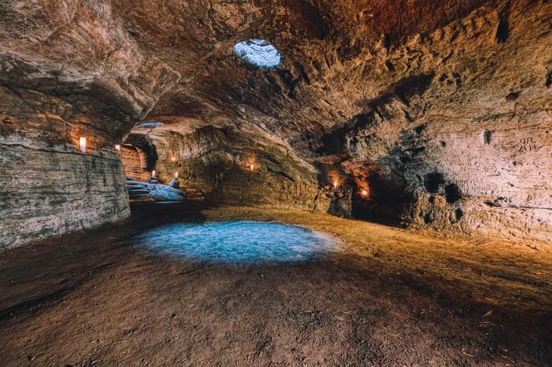 Hella: Guided Tour of Ancient Man-Made Caves - Inside the caves: crosses, carvings, and carved seats