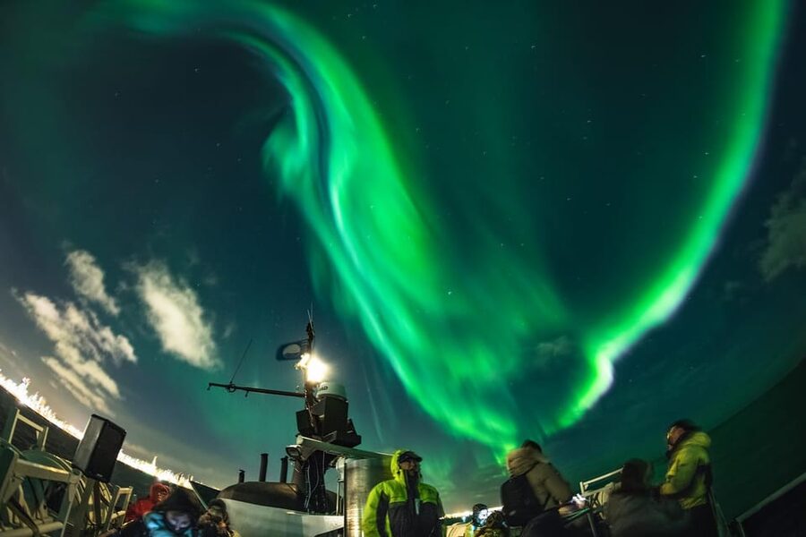 Reykjavik: Northern Lights Guided Boat Tour with Photos - Key highlights at a glance