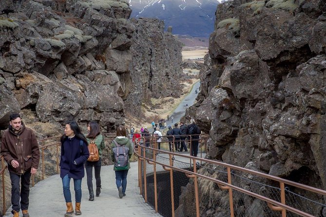 Small-group Golden Circle Classic Tour from Reykjavik - Þingvellir National Park: standing between plates and walking in living history