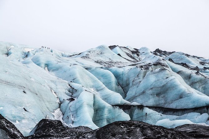 Sólheimajökull Glacier Hike - Small Group Blue Ice Adventure - What to bring: rain gear, gloves, and a hat that fits under the helmet