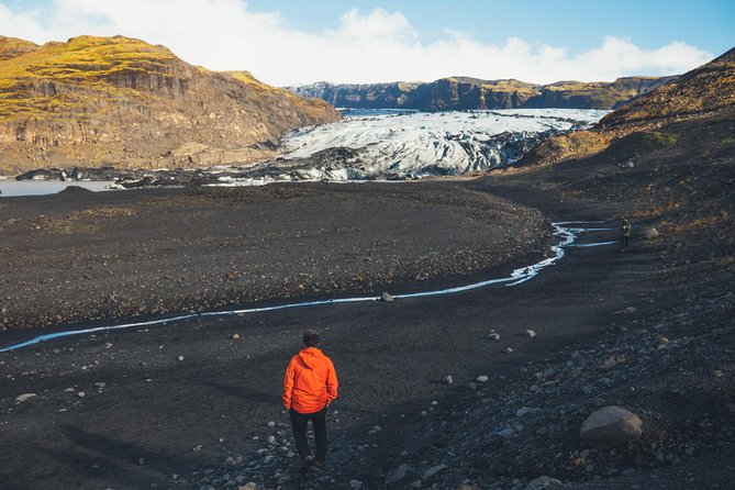 South Coast Day Tour Black Sand Beach & Waterfalls from Reykjavik - Solheimajokull Glacier: Touch the Ice at the Edge